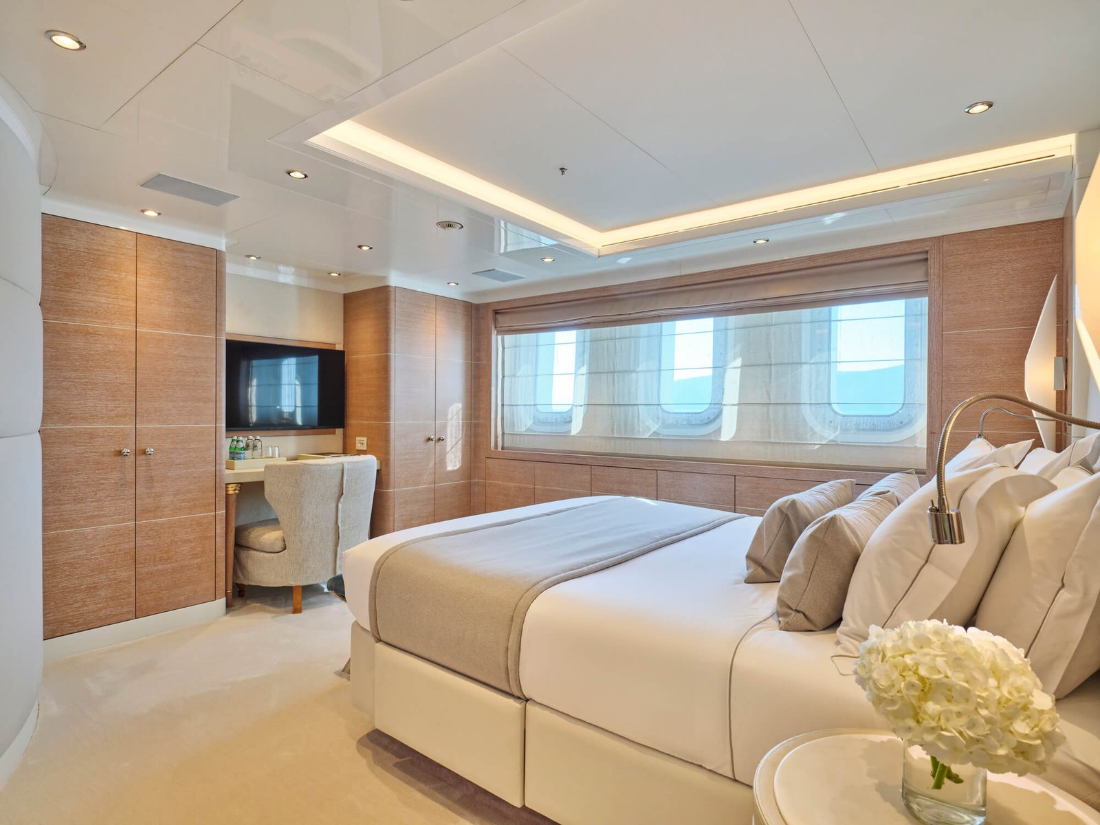 Luxury upper deck master suite on the SEAKID II yacht charter with 180-degree views.