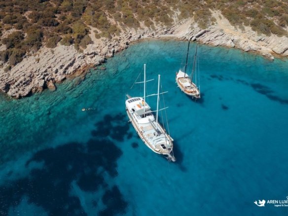 Gulet Bodrum Queen luxury gulet charter anchored in turquoise bay in Bodrum, Turkey