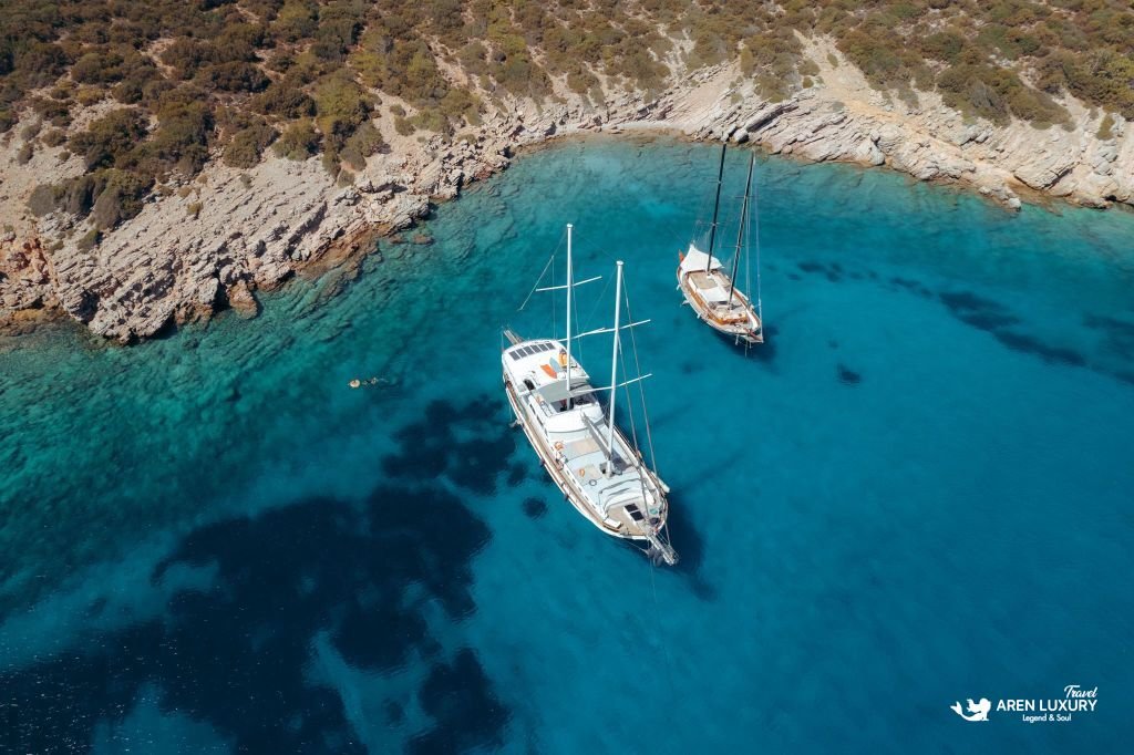Gulet Bodrum Queen luxury gulet charter anchored in turquoise bay in Bodrum, Turkey