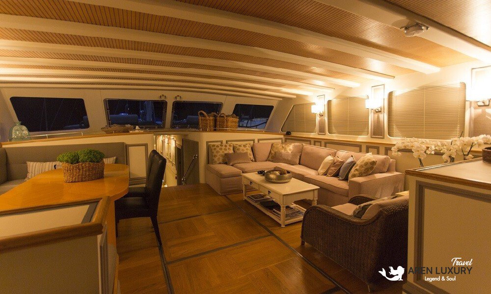 Cobra King luxury gulet interior salon with dining table and plush seating