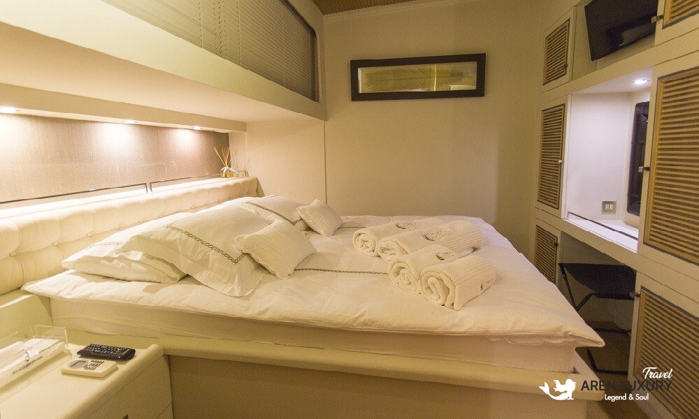 Cobra King luxury gulet double guest cabin with elegant wooden interior and vanity desk