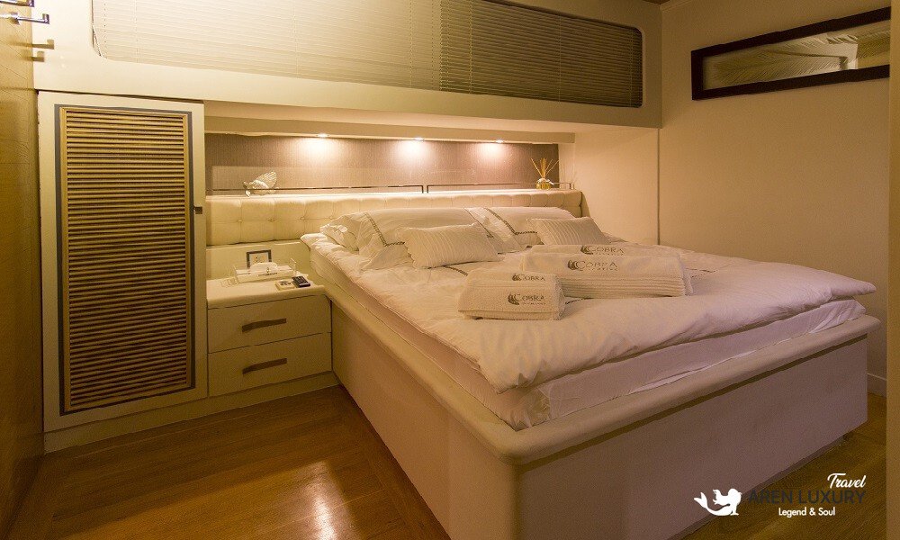 Cobra King gulet double guest cabin with queen-size bed and storage