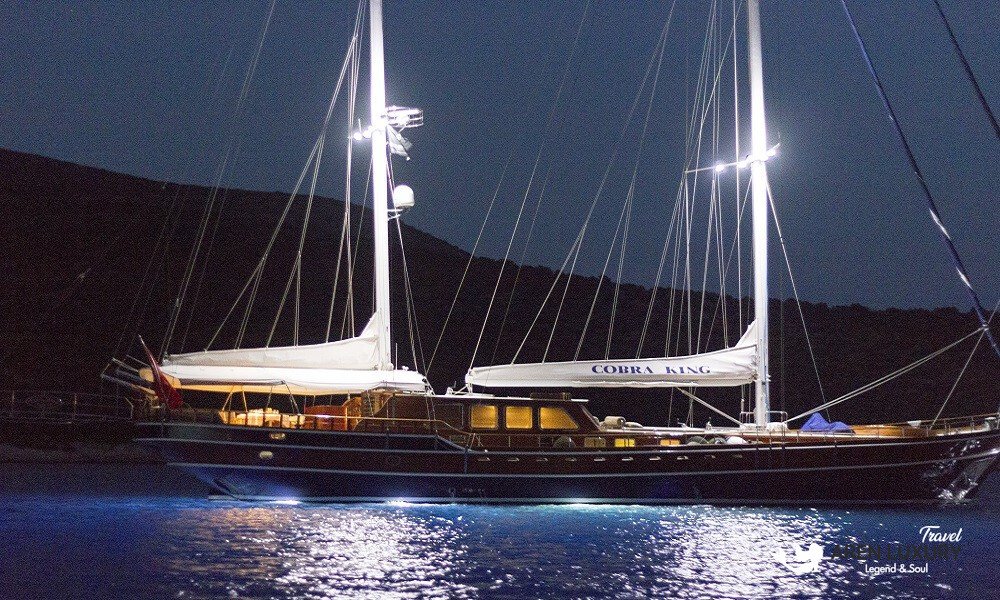 Cobra King luxury gulet yacht illuminated at night in Turkey