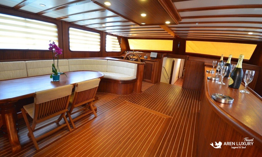 gulet-c-taner-2-turkey-charter Luxury indoor mahogany salon and bar area on the Gulet C Taner 2 Charter Turkey.