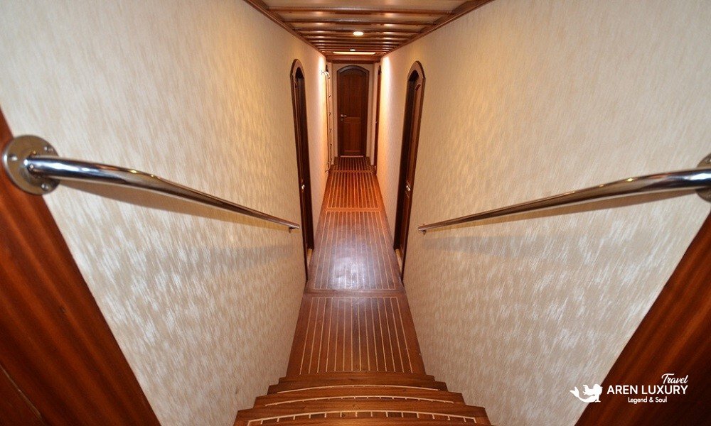 Gulet C Taner 2 Charter Turkey Cabin Corridor Polished wooden interior corridor providing access to 8 luxury cabins on a Gulet C Taner 2 Charter Turkey.