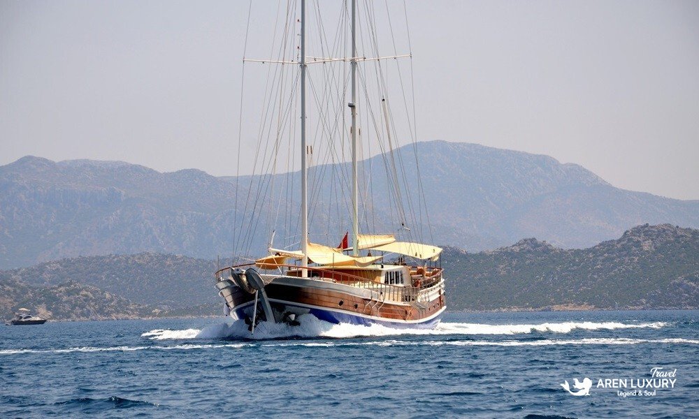 gulet-c-taner-2-turkey-charter Side profile of Gulet C Taner 2 luxury yacht charter sailing along the Turkish coast.