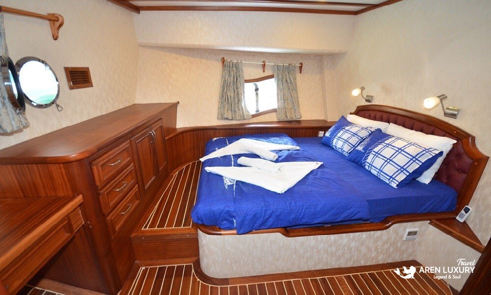 Gulet C Taner 2 Charter Turkey Cabin Interior Elegant double cabin with porthole view on the Gulet C Taner 2 Charter Turkey.