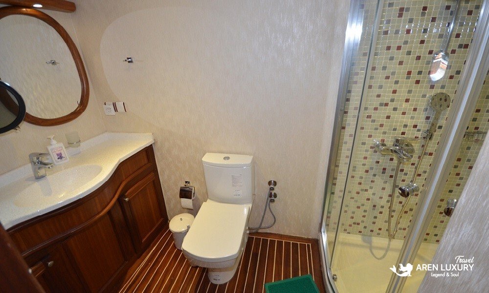 gulet-c-taner-2-turkey-charter Private en-suite bathroom with glass shower cabin on a Gulet C Taner 2 Charter Turkey.