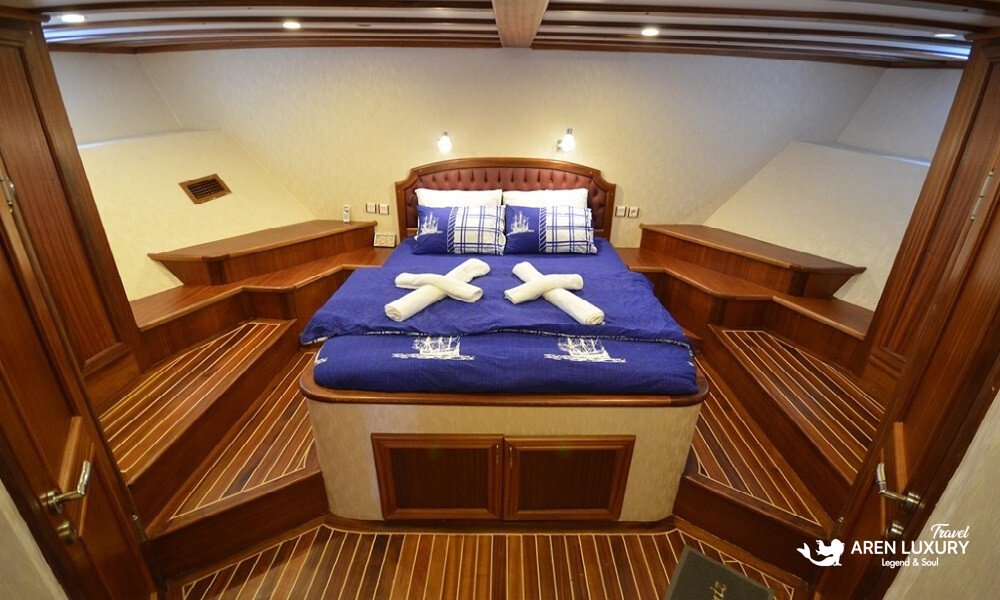 gulet-c-taner-2-turkey-charter A spacious luxury master cabin with a central double bed on a Gulet C Taner 2 Charter Turkey.