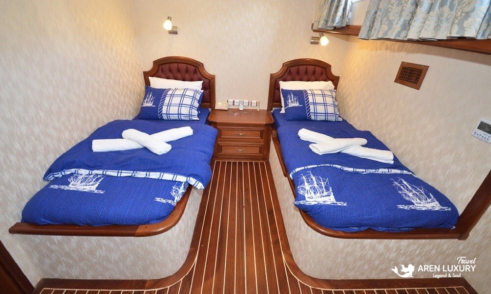 gulet-c-taner-2-turkey-charter Twin guest cabin with separate beds and en-suite on a Gulet C Taner 2 Charter Turkey.