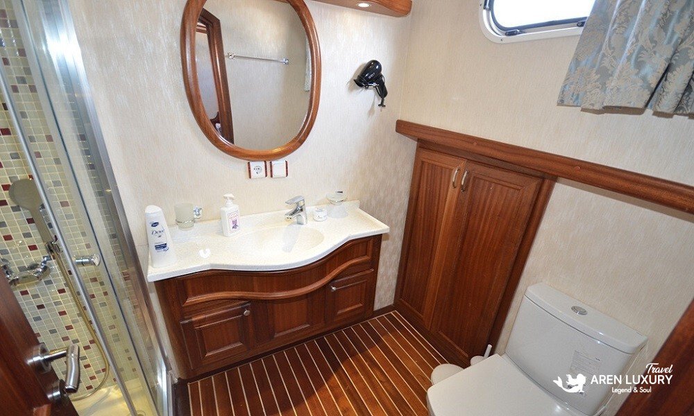 gulet-c-taner-2-turkey-charter Private en-suite bathroom with marble vanity and mosaic tiling on a Gulet C Taner 2 Charter Turkey.