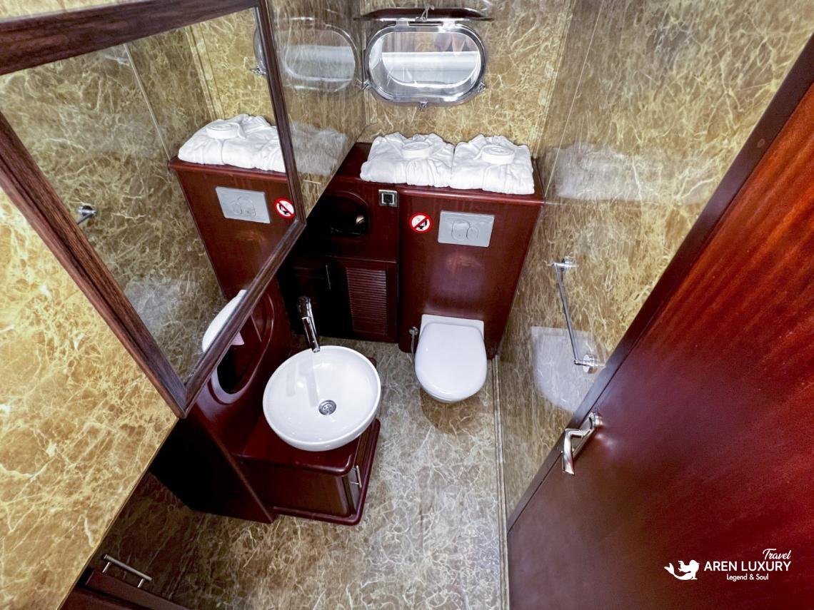 gulet-freedom-luxury-ensuite-bathroom-interior Luxury en-suite bathroom on Gulet Freedom featuring marble-style walls, polished wood finishes, and modern white fixtures.