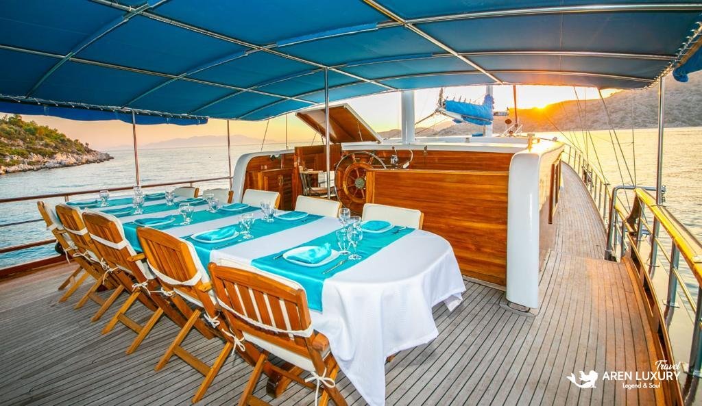 The aft deck dining area of Gulet Gokce, perfect for a private blue cruise with gourmet Turkish cuisine.