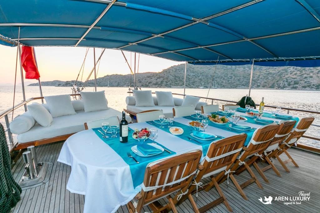 A variety of traditional Turkish mezes and fresh seafood dishes served on the dining table of Gulet Gokce.