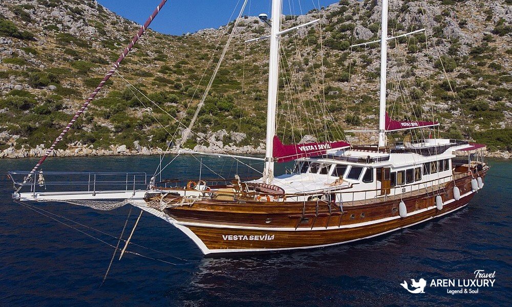 Gulet Vesta 1 Sevil Charter Turkey aerial view cruising in a turquoise bay
