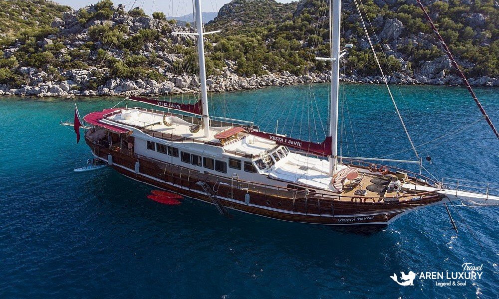 Gulet Vesta 1 Sevil Charter Turkey aerial view cruising in a turquoise bay