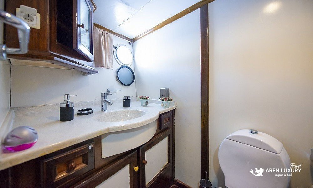 Gulet Vesta 1 Sevil en-suite bathroom with modern vanity and porthole window