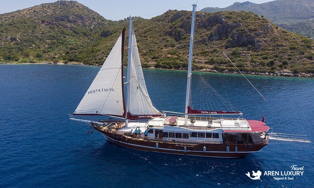 Gulet Vesta 1 Sevil Charter Turkey aerial view cruising in a turquoise bay