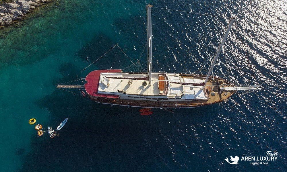 Gulet Vesta 1 Sevil Charter Turkey aerial view cruising in a turquoise bay
