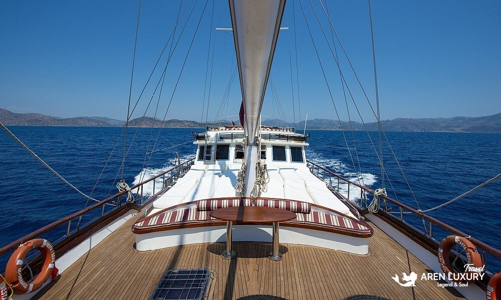 Gulet Vesta 1 Sevil luxury yacht deck view with sunbathing area and wooden mast