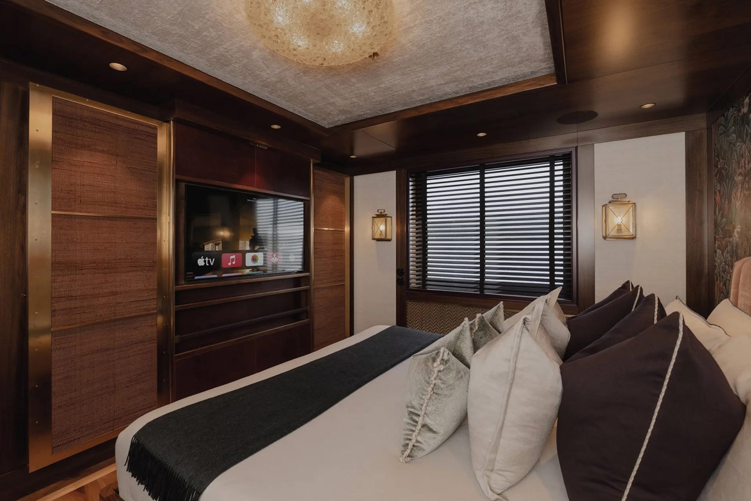 Luxury master suite interior on the Pink Shadow Damen Yacht Charter expedition vessel.