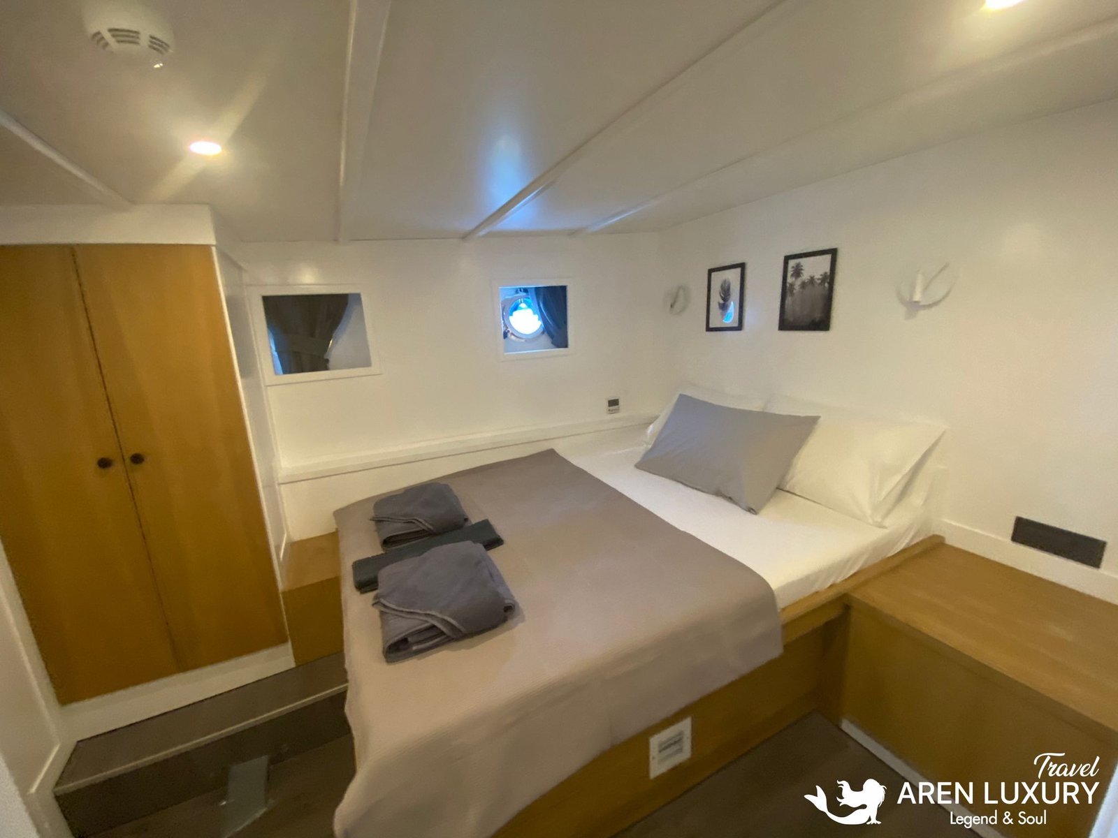 Gulet Albatros M Luxury Double Cabin Luxury double cabin interior of Gulet Albatros M with minimalist design, wooden accents, and comfortable bedding.