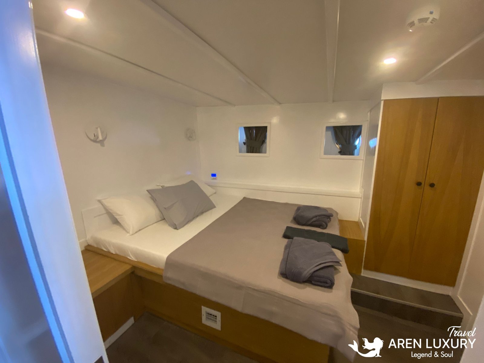 Gulet Albatros M Starboard Double Cabin Elegant double cabin on the starboard side of Gulet Albatros M with clean white walls and natural wood furnishings.