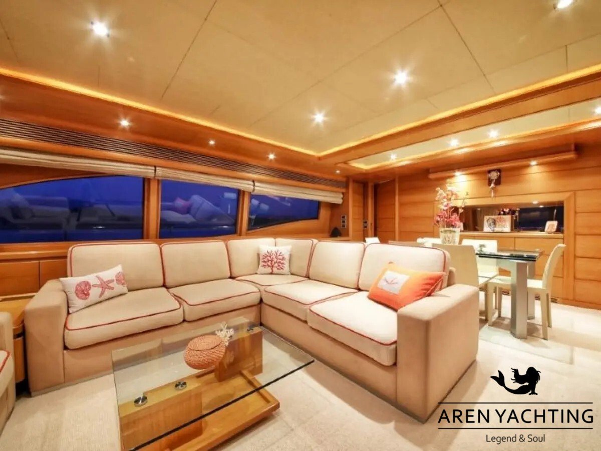 Luxury indoor salon lounge area with an L-shaped sofa inside the FUNDA D motor yacht for charter in Göcek.